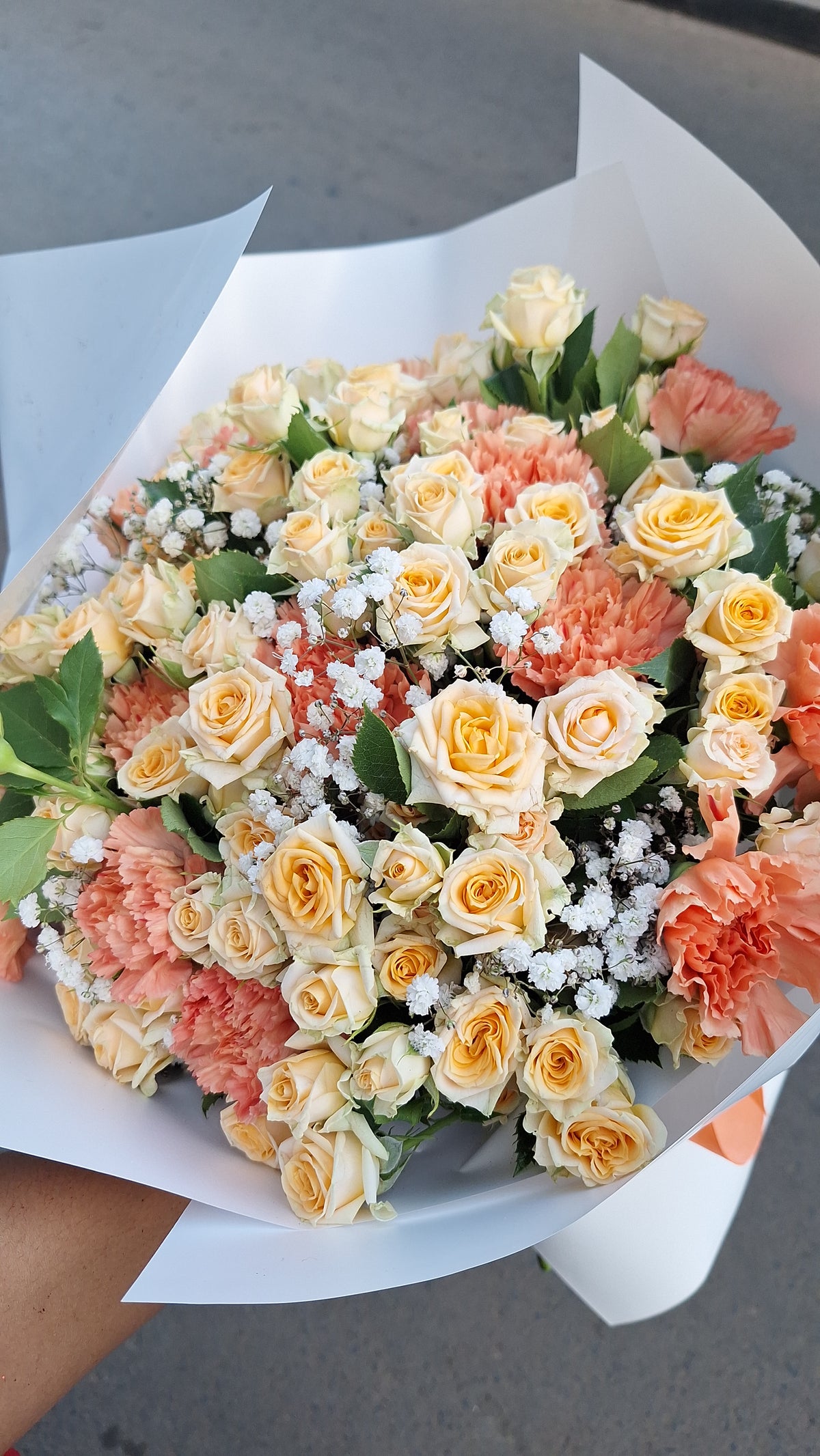 Peach Mix With Carnations and Baby Breath.