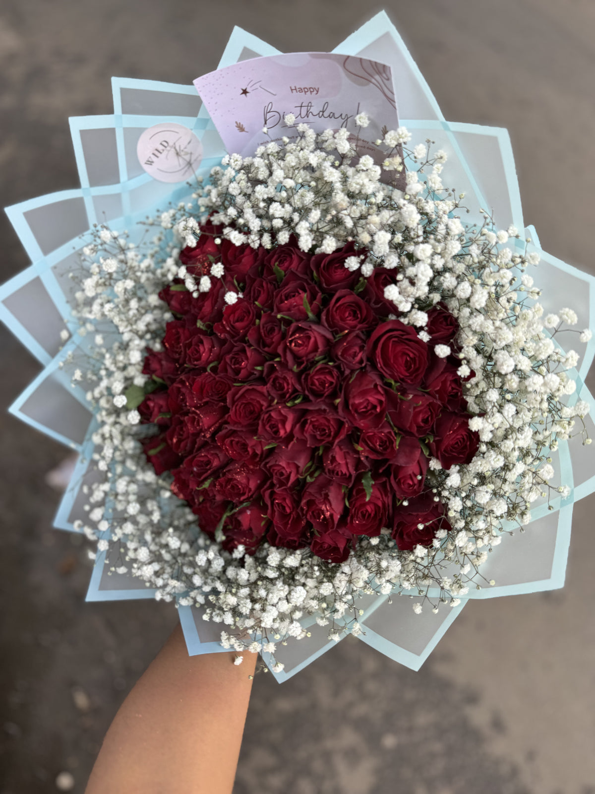 Red Roses with Blue Wrapping.